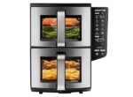 Stainless steel double-drawer air fryer with a digital control panel on the right; top drawer shows salmon and vegetables, bottom drawer shows chicken and fries.