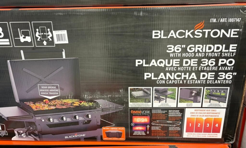 Box for Blackstone 36-inch griddle with hood and front shelf, featuring a grilling setup image and product branding on the box.