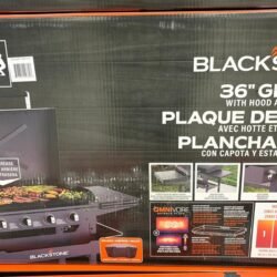 Box for Blackstone 36-inch griddle with hood and front shelf, featuring a grilling setup image and product branding on the box.