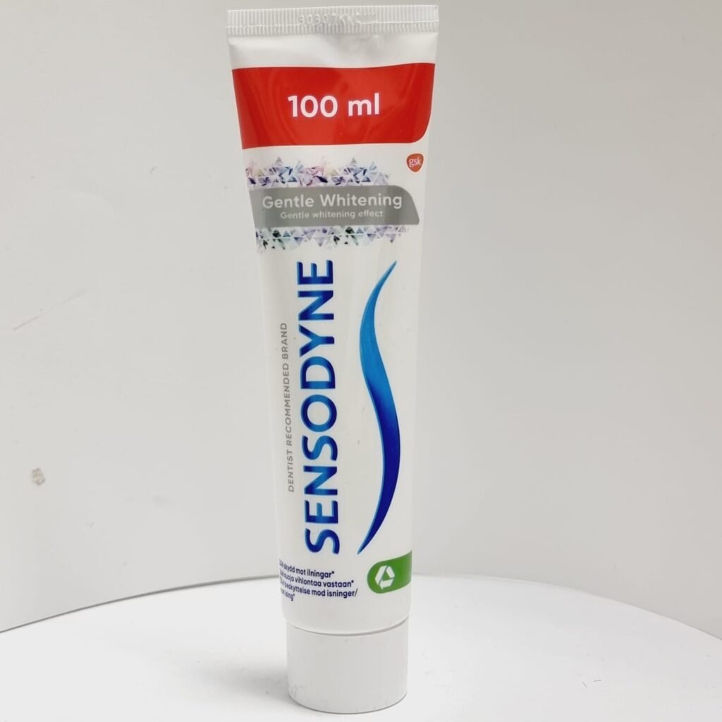 SENSODYNE toothpaste tube standing upright showing 100 ml and Gentle Whitening label.