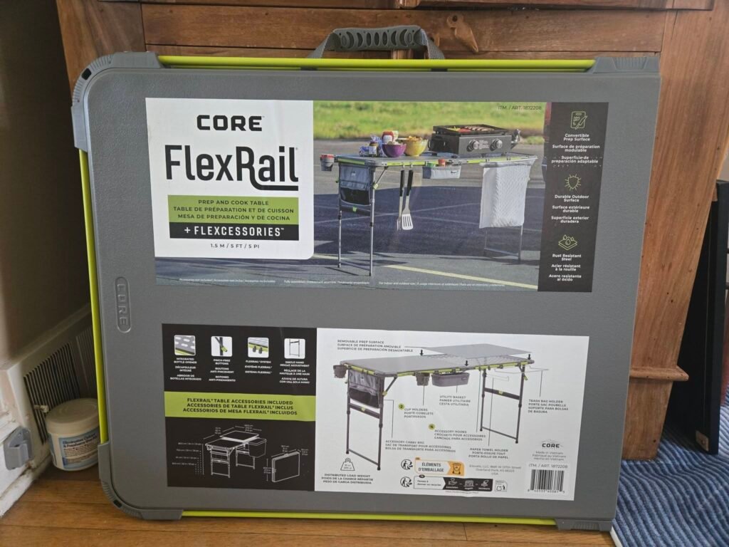 Grey Core FlexRail product case with a large label showing a grill setup and feature icons; an outdoor kitchen system image on the front panel.
