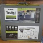 Grey Core FlexRail product case with a large label showing a grill setup and feature icons; an outdoor kitchen system image on the front panel.