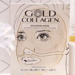 Front of a Gold Collagen hydrogel mask box featuring a line-drawn woman's face and product tagline.