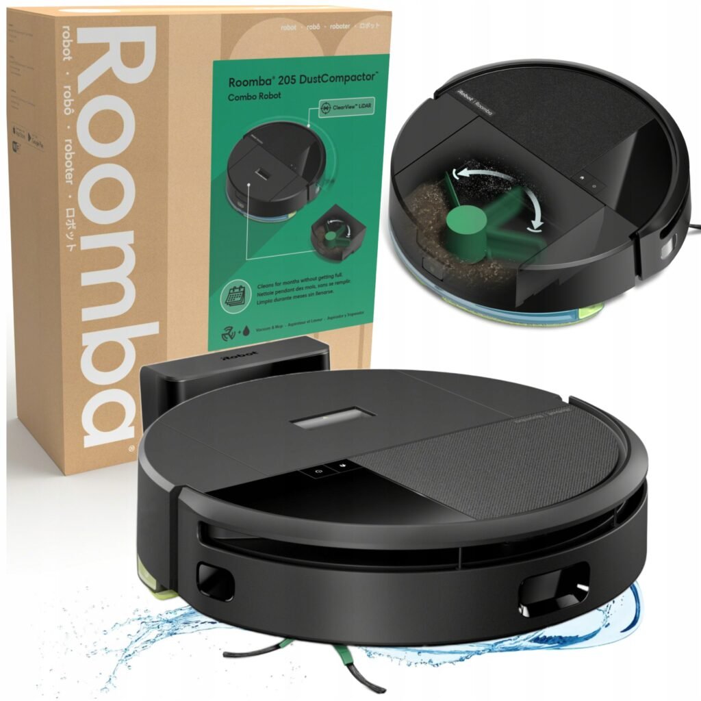 Roomba box and a black robotic vacuum sitting on a white surface, with a green label on the box visible.