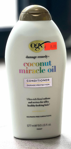 Screenshot 2026-07-12 114706 - Radau Viska OGX Coconut Miracle Oil Conditioner bottle with gold cap, white container, product name and 'Damage Remedy' label, price sticker visible.