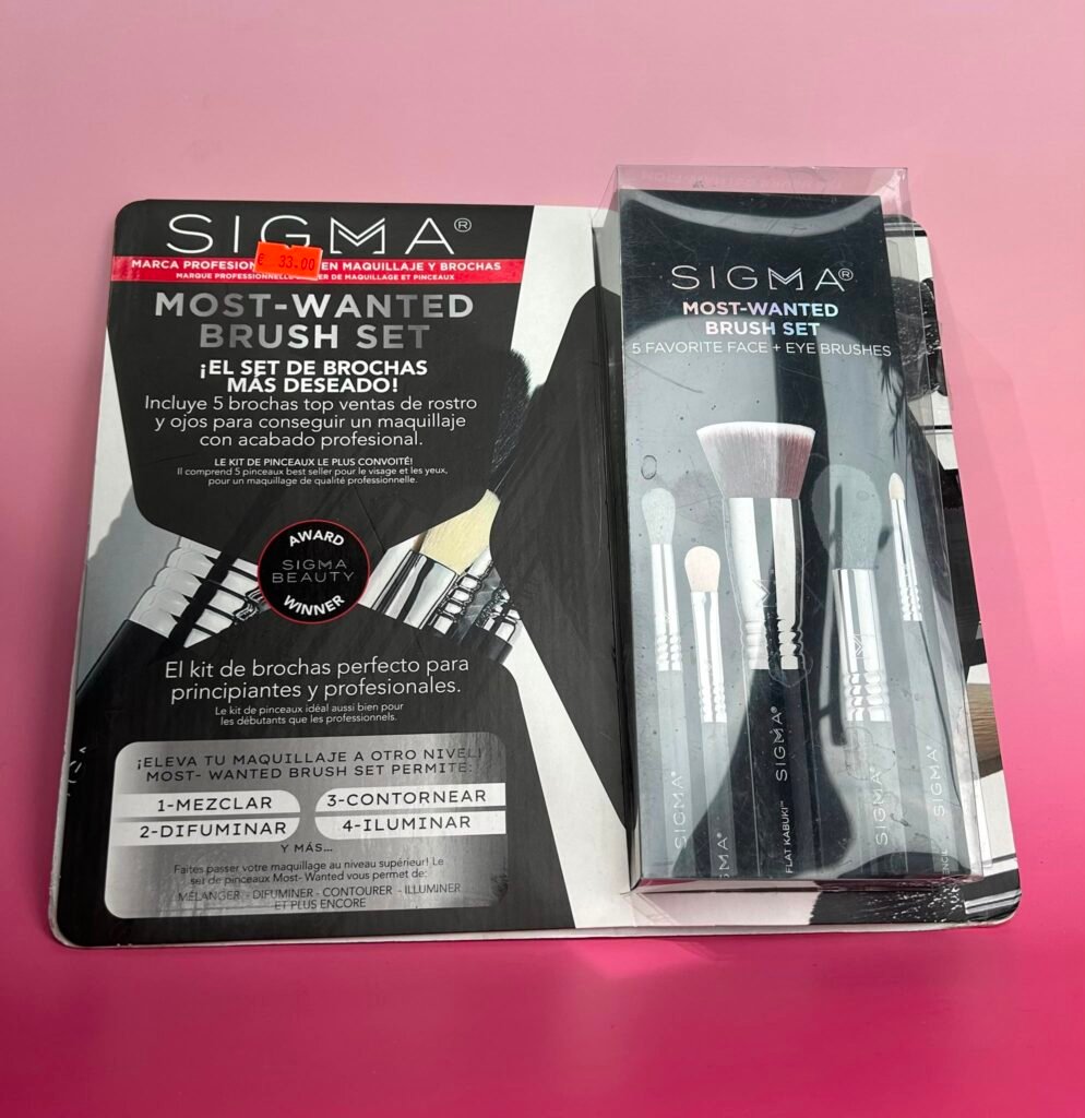 Sigma Most-Wanted Brush Set packaging on a pink surface, with a small red price sticker visible.