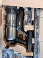 Cordless vacuum canister with attachments packed in a molded pulp insert inside a cardboard box