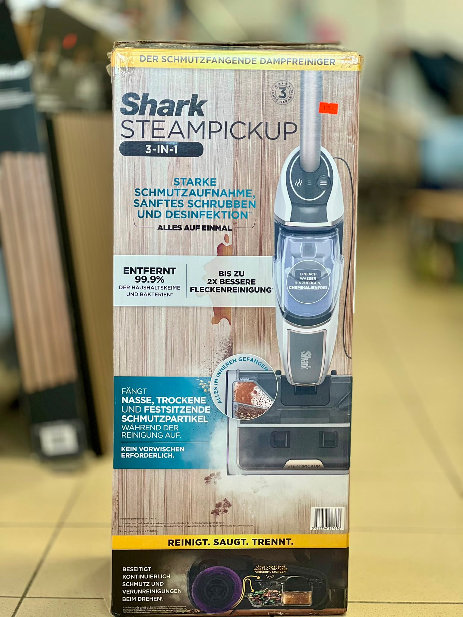 WhatsApp Image 2026-07-20 at 162410 - Radau Viska Shark SteamPickup 3-in-1 box on a store shelf showing steam cleaning and disinfection features (German text).
