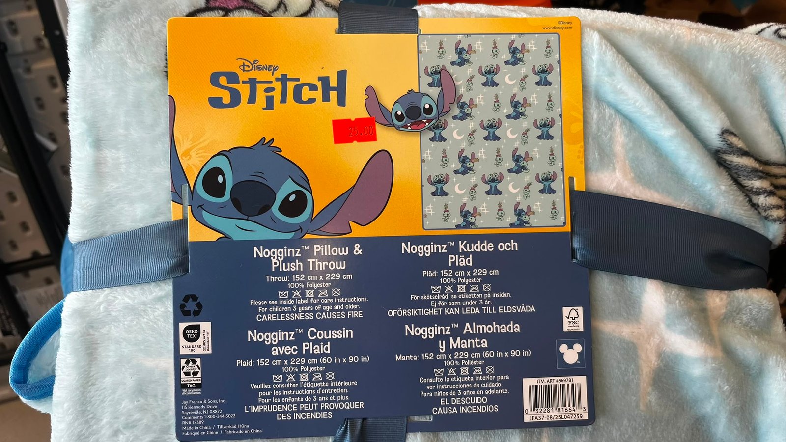 WhatsApp Image 2026-07-31 at 120013 - Radau Viska Disney Stitch plush toy packaging with orange background and a silicone Stitch graphic; price tag shows 25.00 and a patterned insert with Stitch images on gray panel