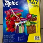 Blue Ziplock variety pack box with yellow panel showing '347' total bags; torn packaging visible on top edge, fruit and sandwich bags pictured on front, indicating storage bags assortment for home use.