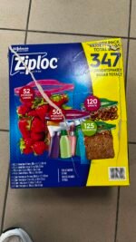 Blue Ziplock variety pack box with yellow panel showing '347' total bags; torn packaging visible on top edge, fruit and sandwich bags pictured on front, indicating storage bags assortment for home use.