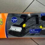 Orange packaging box for a 4-in-1 car cleaning/polishing kit, showing a foam polishing pad and attachment on the front panel