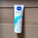 Tube of NIVEA Soft refreshing moisturizing cream (75 ml) standing upright on a cardboard surface.