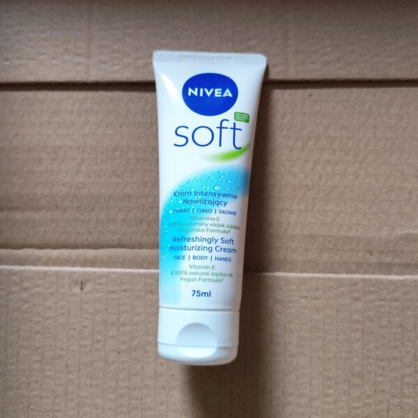 Tube of NIVEA Soft refreshing moisturizing cream (75 ml) standing upright on a cardboard surface.
