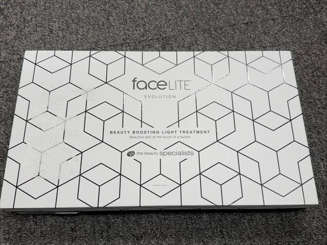 images 8 - Radau Viska White rectangular packaging with a geometric hex pattern, labeled 'faceLITE Evolution' and 'Beauty Boosting Light Treatment' by the beauty specialists.