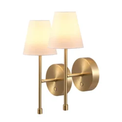 Two-light brass wall sconce with cream fabric shades on a white background