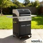 Propane gas grill on a concrete patio with side shelves and a black cabinet base, Nexgrill logo visible in corner, backyard scene.
