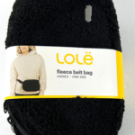 Black fuzzy fleece belt bag by LOLË with a yellow label around it on a white background