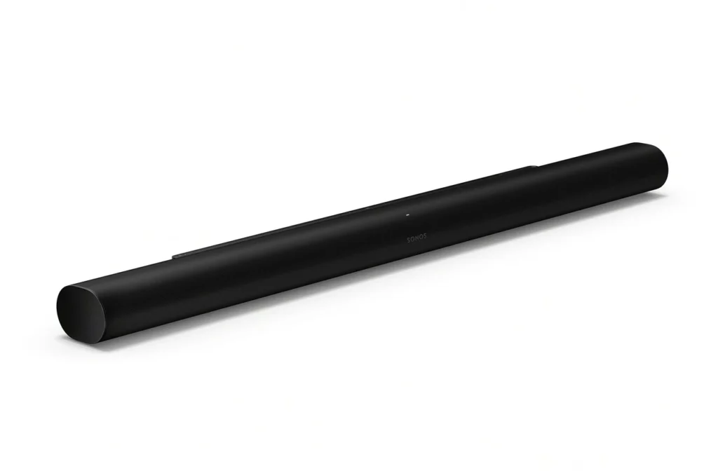 Long black Sonos soundbar resting on a white surface, viewed from a slight angle