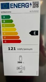 EU energy label on a LG refrigerator showing energy class E, 386 L capacity, 38 dB noise level