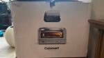 Box for a Cuisinart countertop oven; front shows an image of the oven interior and control panel with the brand name visible at the bottom edge of the box.