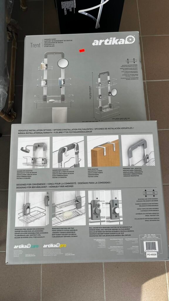 Boxed Artikal Trent shower caddy with chrome rack and shelves, showing installation diagrams and accessories visuals.