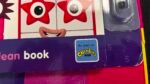 Close-up of a children's book cover showing cartoon red star faces and a Beebies BBC badge with 'As seen on' text.
