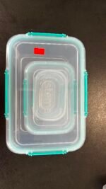 Stack of clear airtight plastic food storage containers with teal locking lids.