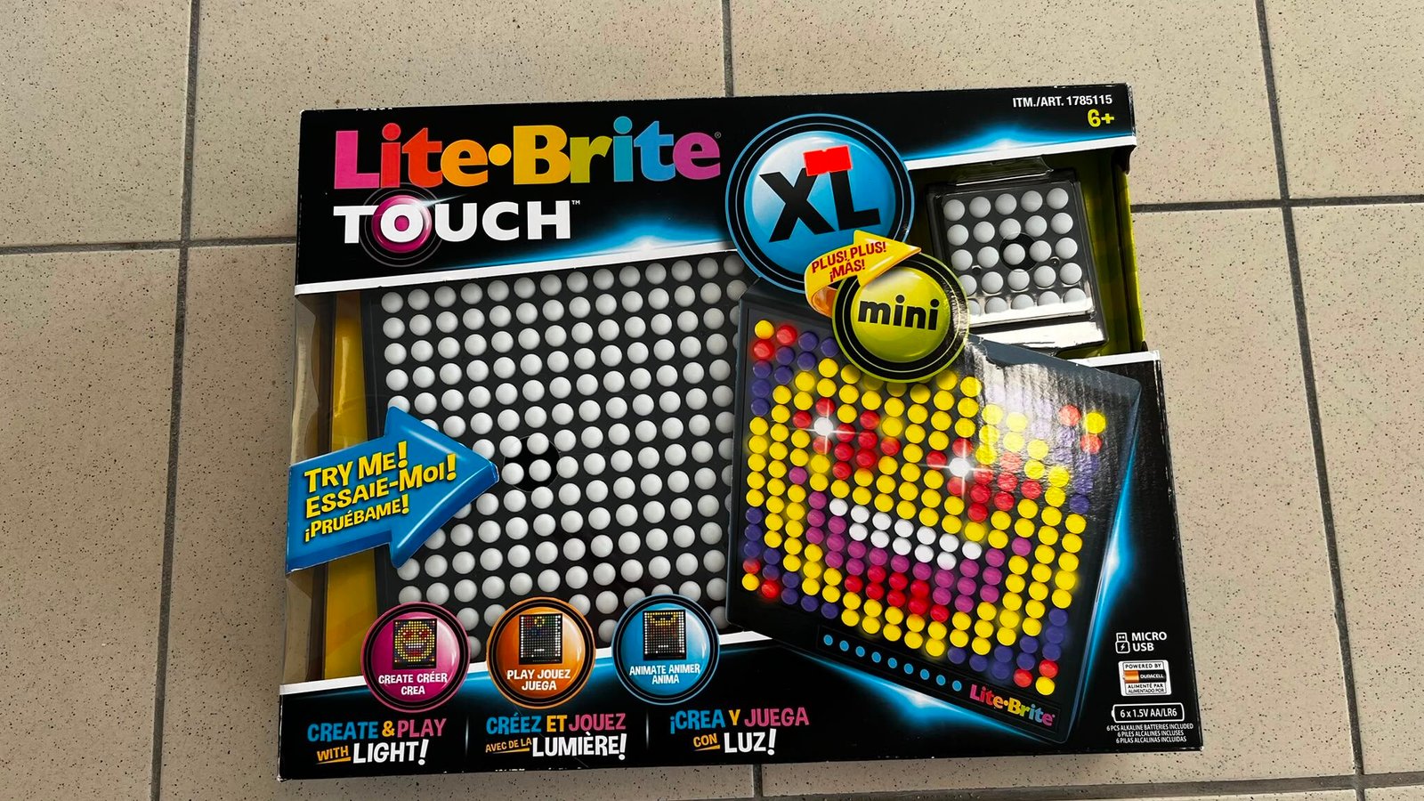WhatsApp Image 2026-08-04 at 114648 - Radau Viska Lite-Brite Touch XL toy packaging with a grid of colorful pegs on display, on a tiled floor.