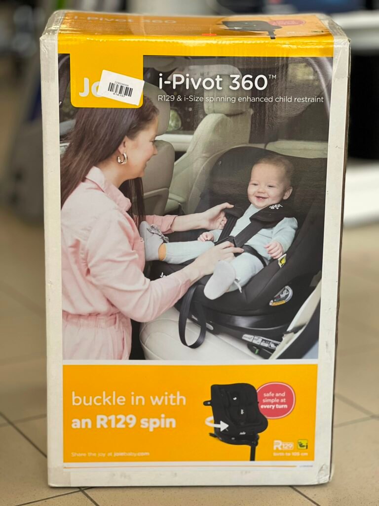 Box showing Joie i-Pivot 360 baby car seat with a smiling mother adjusting her baby in the seat in a car image on the package.
