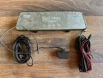 Road Angel car safety device with multiple cables laid out on a wooden surface, ready for install and setup on a desk.