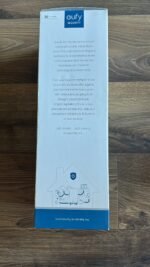 Box for euFy Security Local Security system, white with blue logo at top and text about home security and no monthly fee on a wooden floor.