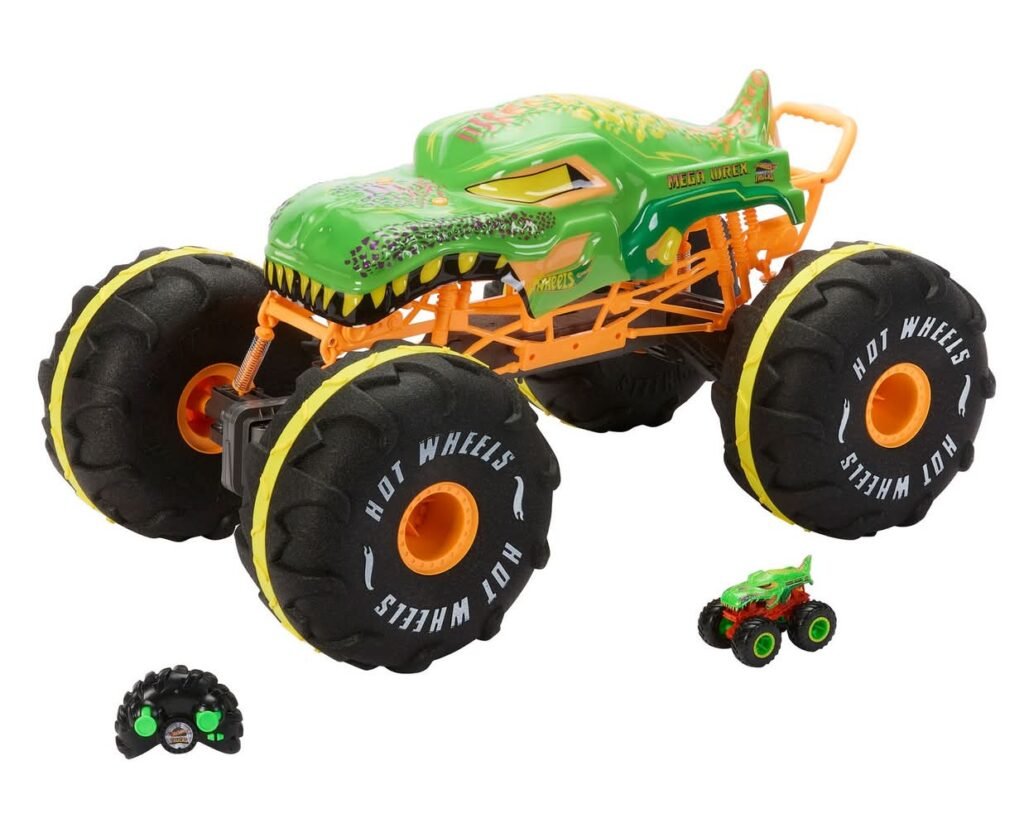 Green monster-truck toy with oversized black tires and orange chassis, shown with its remote and a small matching car beside it.