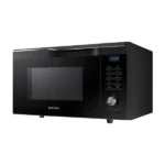 Black Samsung countertop microwave with digital clock and control panel on the right side.