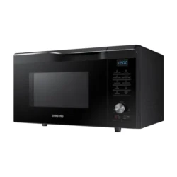 Black Samsung countertop microwave with digital clock and control panel on the right side.
